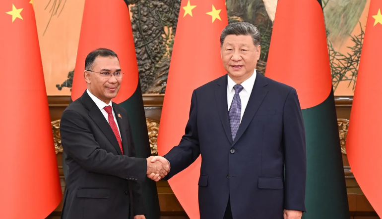 Chinese President Xi shakes hands with Bangladeshi Prime Minister Tarique Rahman in Beijing on June 26. 